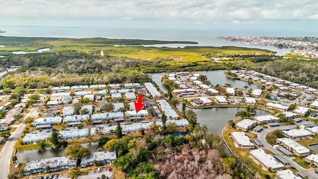 birds eye view of property with a water view and a residential view