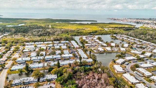 bird's eye view featuring a water view and a residential view