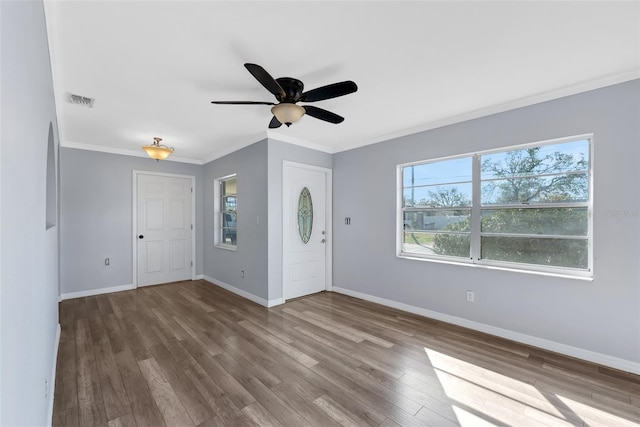 entryway with crown molding, ceiling fan, and wood-type flooring