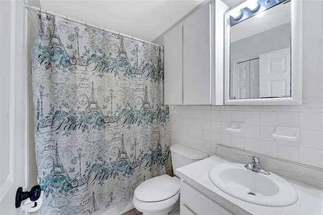 bathroom featuring vanity, a shower with shower curtain, tile walls, and toilet