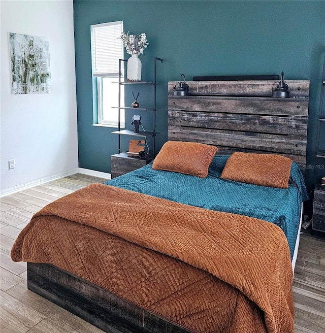 bedroom with hardwood / wood-style floors