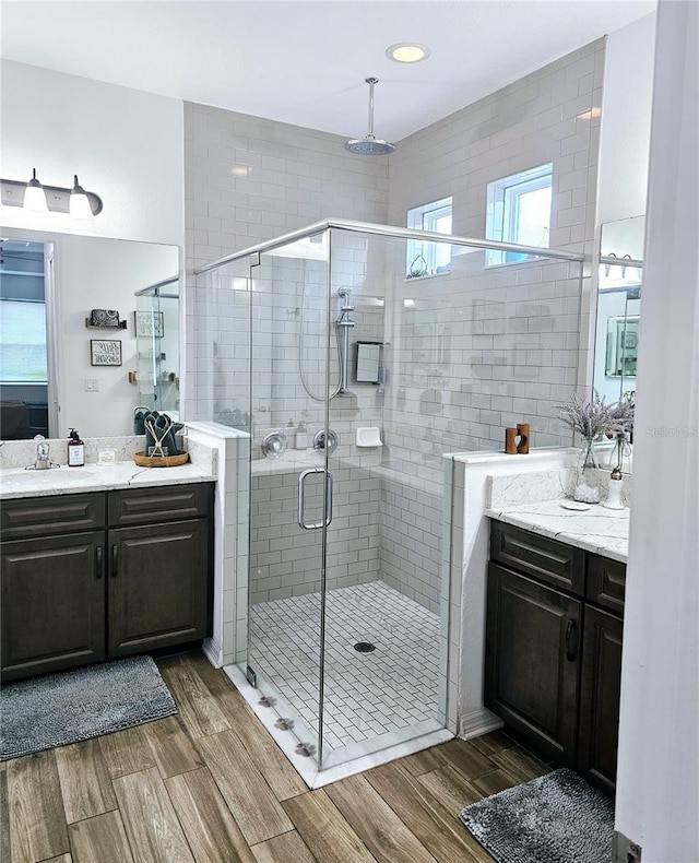 bathroom with vanity and an enclosed shower