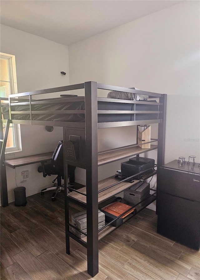 bedroom featuring hardwood / wood-style floors