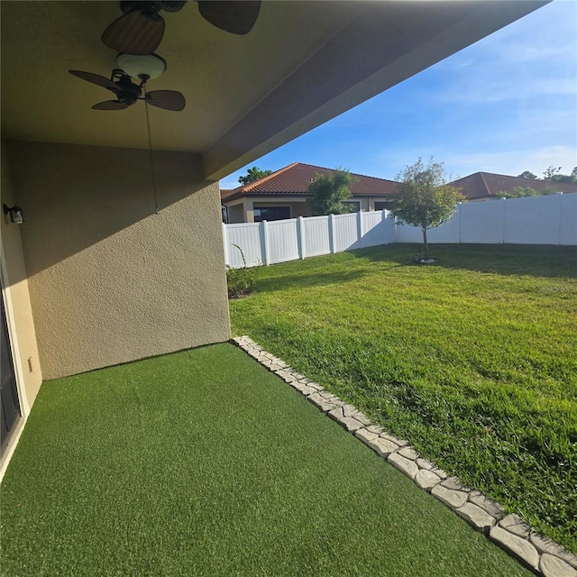 4035 Solamor St, Lakeland, FL 33810 - view of yard with a fenced backyard and a ceiling fan