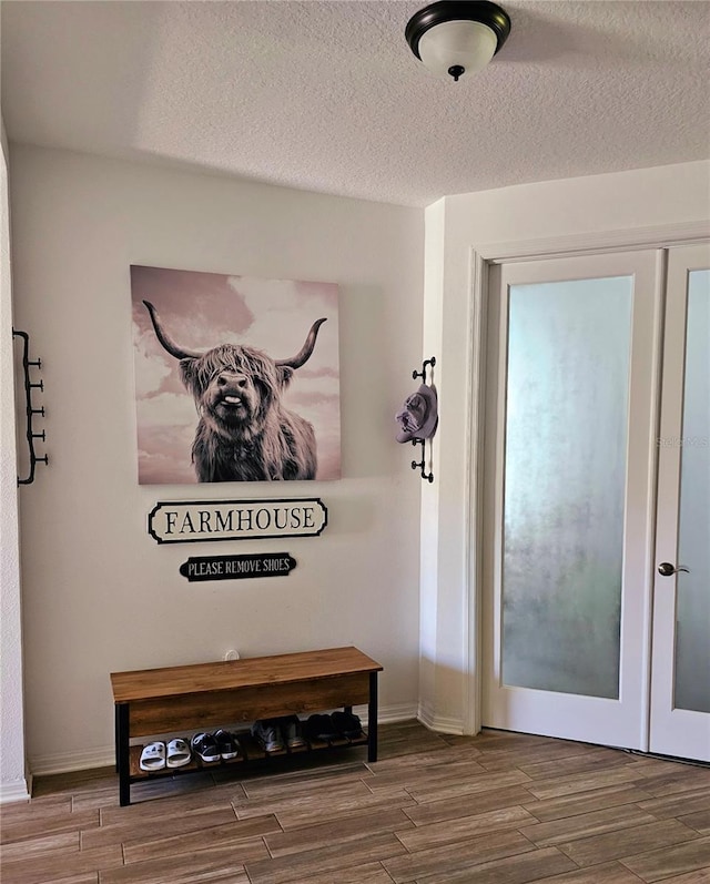 4035 Solamor St, Lakeland, FL 33810 - hall with baseboards, wood finished floors, and a textured ceiling