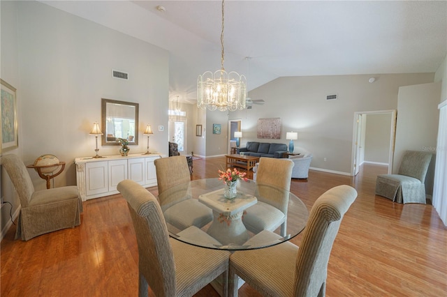 dining space featuring light wood-style flooring, visible vents, and a chandelier