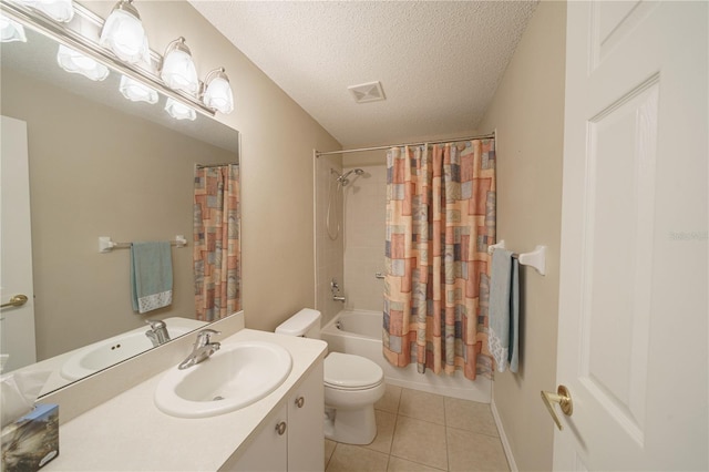 full bath with a textured ceiling, toilet, vanity, visible vents, and tile patterned floors