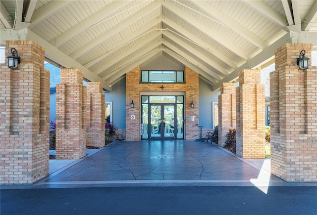 property entrance with french doors and brick siding