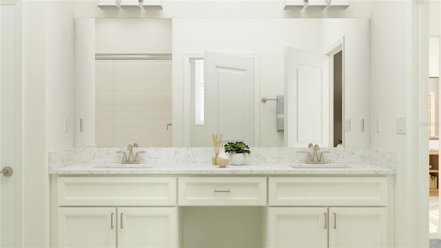 bathroom with walk in shower and vanity