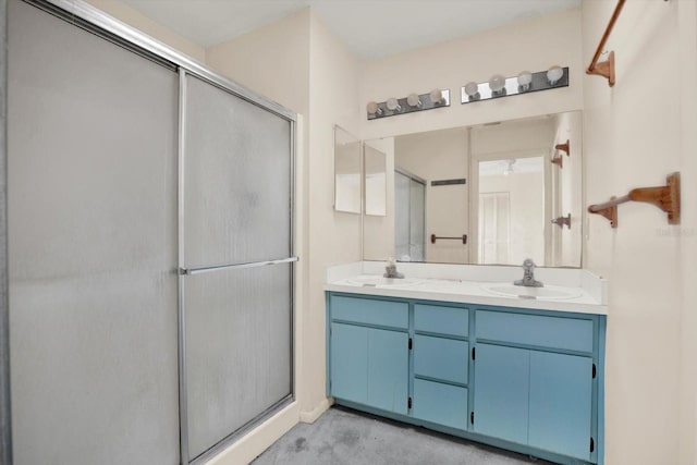 bathroom with an enclosed shower, vanity, and concrete floors