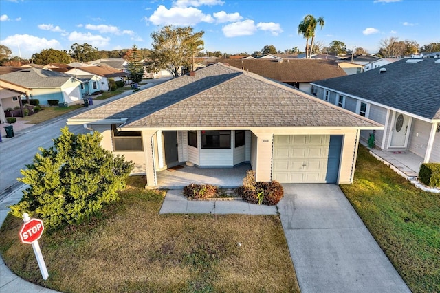 view of front facade with a garage and a front lawn