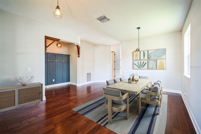 dining area with dark hardwood / wood-style flooring