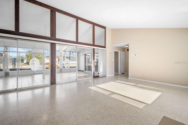 interior space featuring a towering ceiling