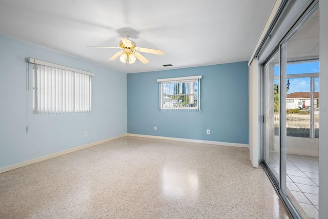 spare room with ceiling fan