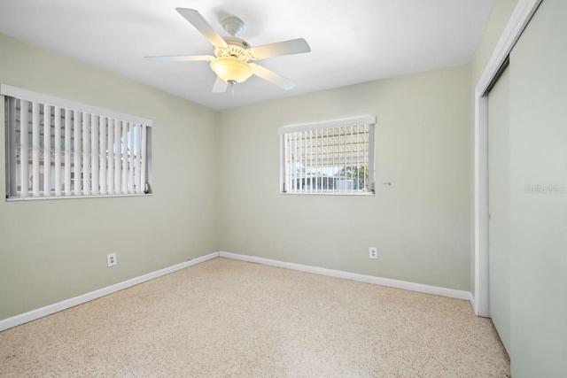 unfurnished bedroom featuring a closet and ceiling fan