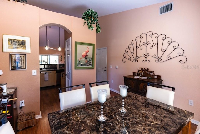 dining area with dark hardwood / wood-style floors