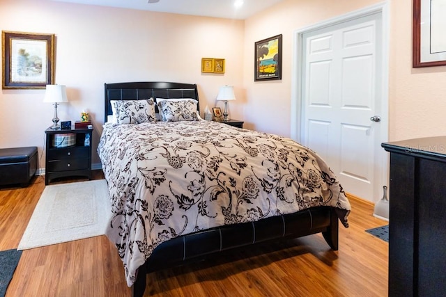 bedroom with hardwood / wood-style flooring