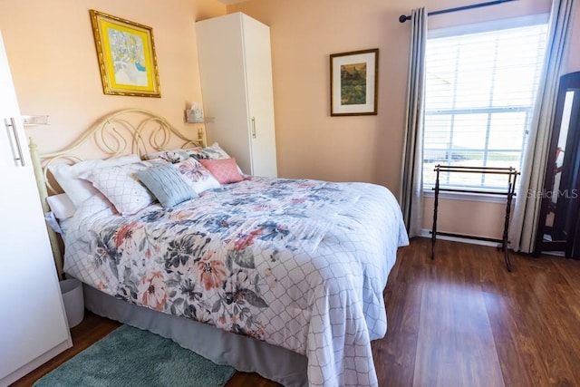 bedroom featuring dark hardwood / wood-style flooring