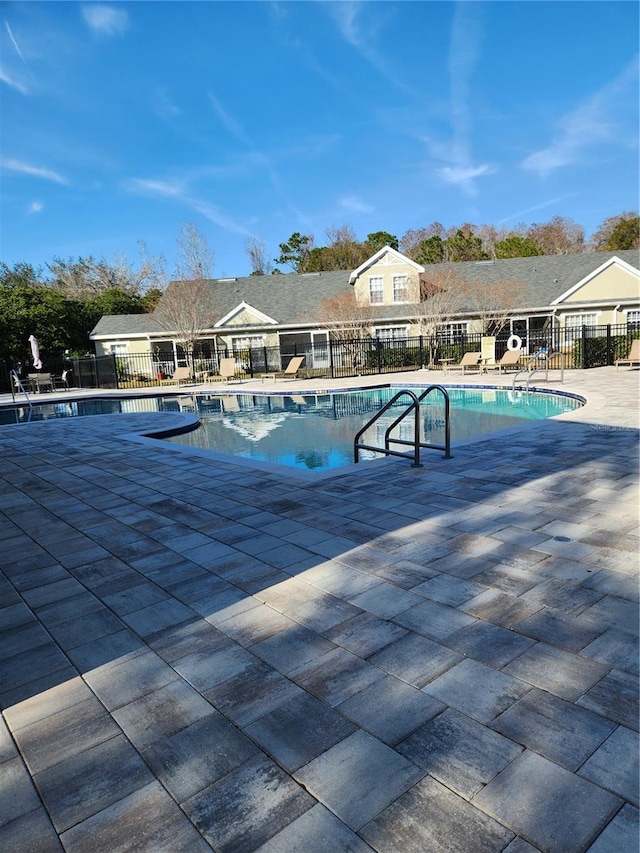 view of swimming pool with a patio area