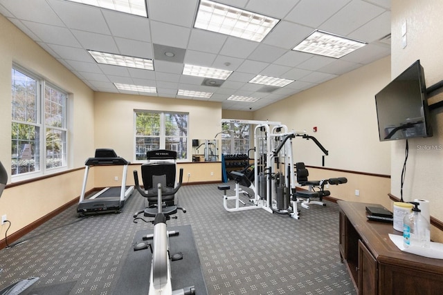 workout area with a paneled ceiling