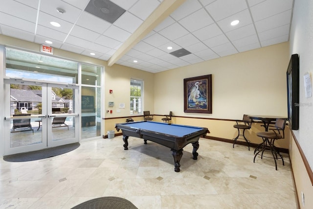 game room featuring a drop ceiling, pool table, and french doors