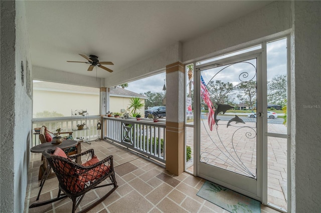 exterior space with ceiling fan