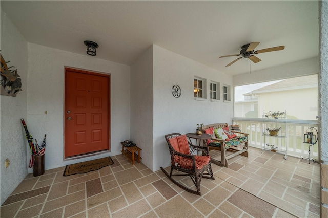 entrance to property featuring ceiling fan