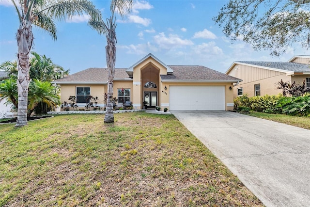 ranch-style house featuring a garage and a front yard