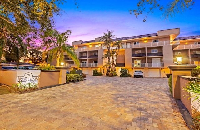 view of outdoor building at dusk