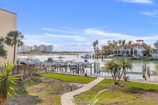 dock area featuring a water view and a yard