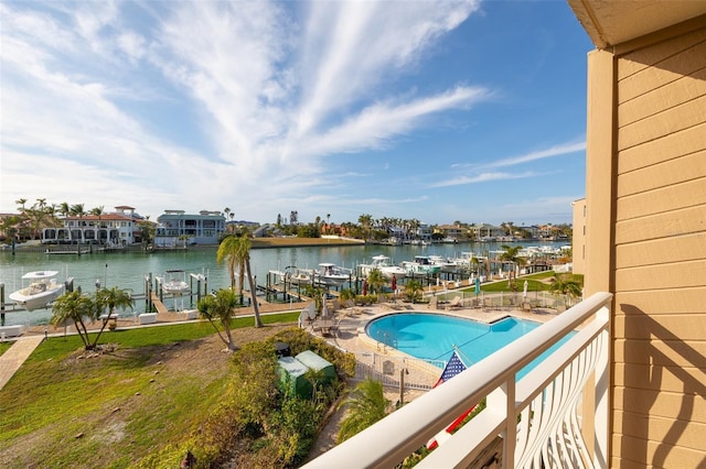 view of pool featuring a dock and a water view