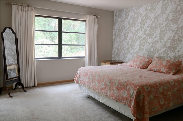 carpeted bedroom with multiple windows