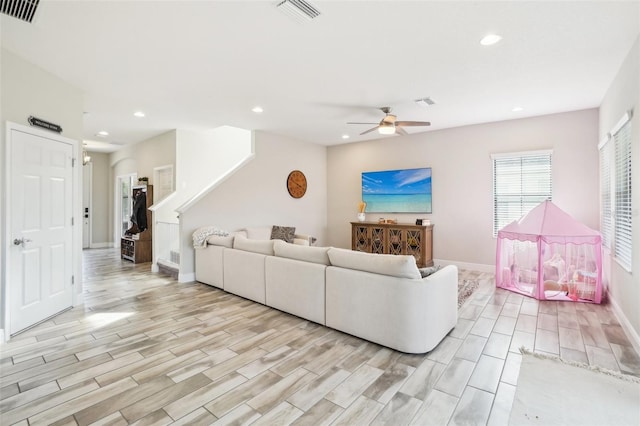 living room with ceiling fan