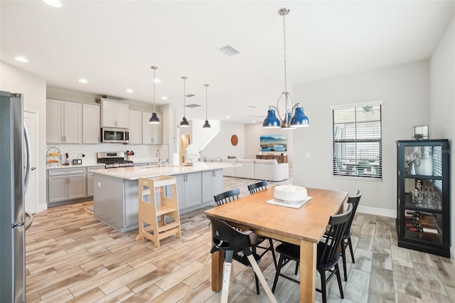 dining room with light wood-type flooring