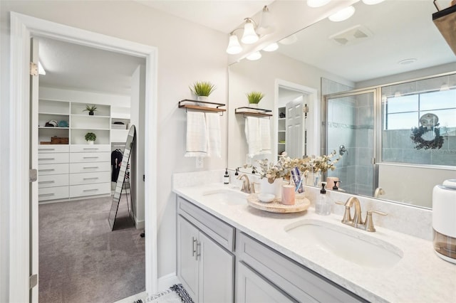 bathroom with vanity and an enclosed shower