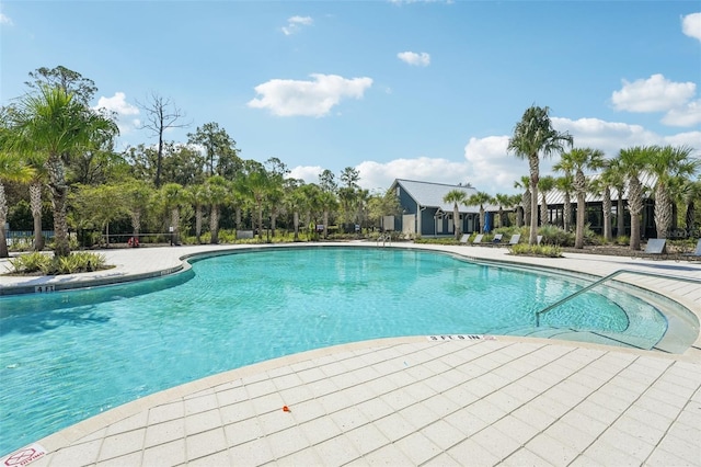 view of swimming pool featuring a patio area