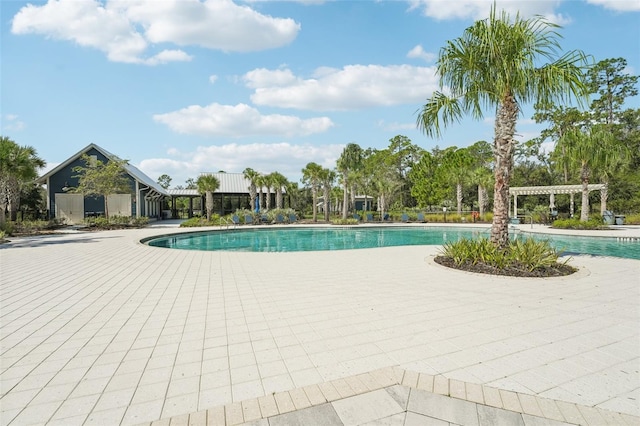 view of swimming pool with a pergola