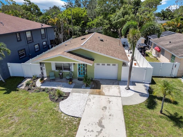 view of front facade featuring a garage and a front yard