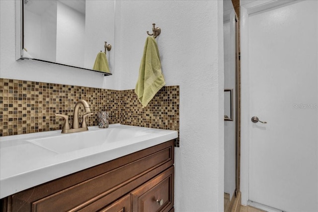 bathroom featuring backsplash and vanity