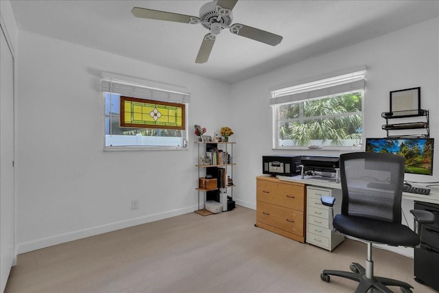 home office with ceiling fan, baseboards, and light wood-type flooring