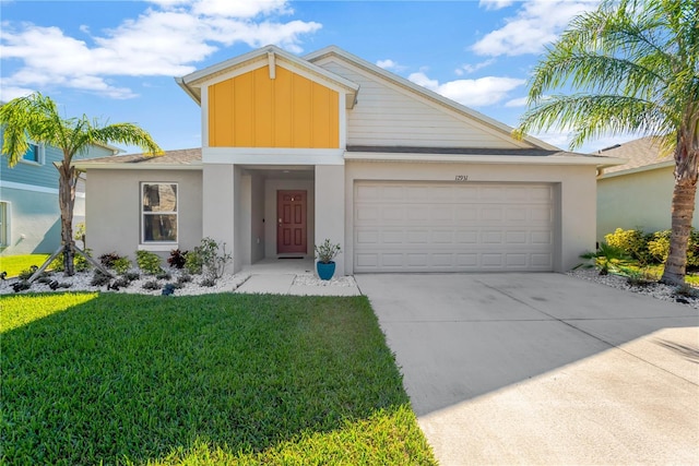 view of front of property with a garage and a front yard