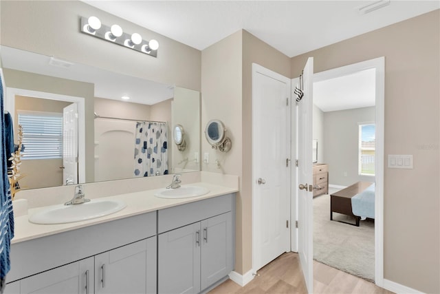 bathroom featuring hardwood / wood-style flooring and vanity