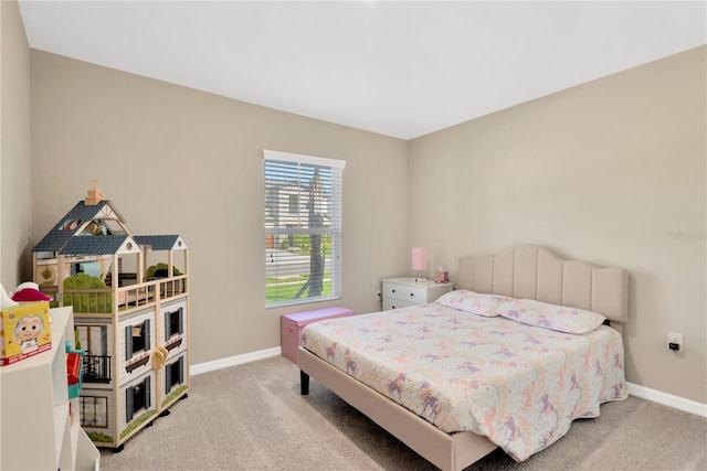 bedroom featuring light colored carpet