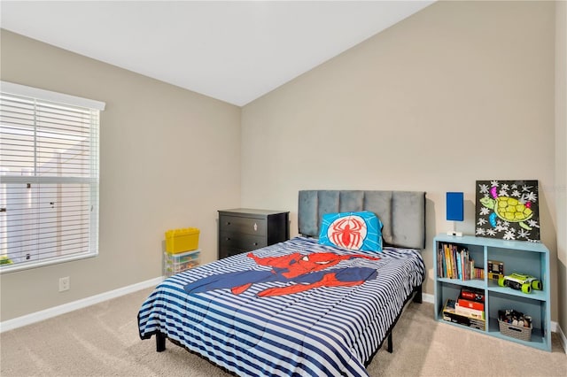 carpeted bedroom with vaulted ceiling