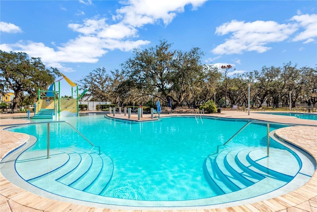 view of swimming pool with a patio