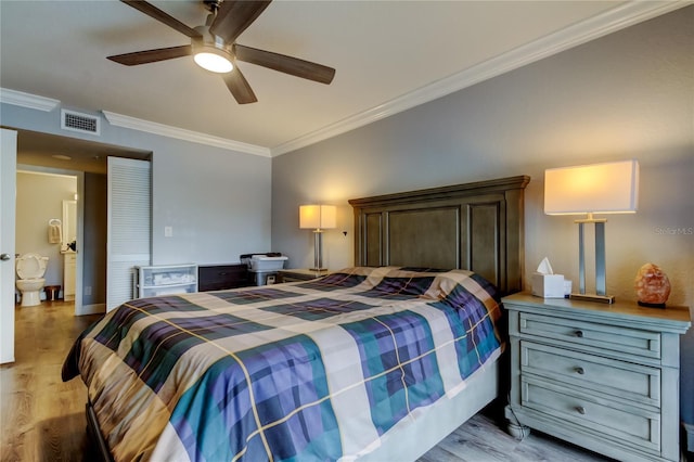 bedroom featuring ceiling fan, ornamental molding, and light wood-type flooring