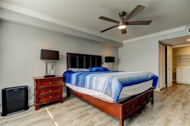 bedroom featuring crown molding, ceiling fan, and light wood-type flooring