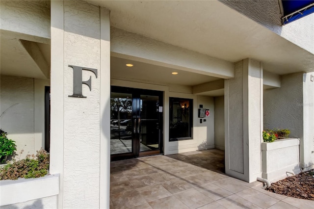 doorway to property with a patio area