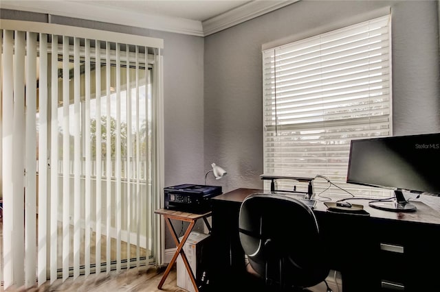 home office featuring crown molding, hardwood / wood-style flooring, and baseboard heating