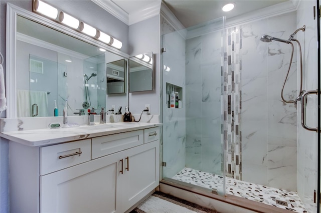 bathroom featuring ornamental molding, vanity, and walk in shower